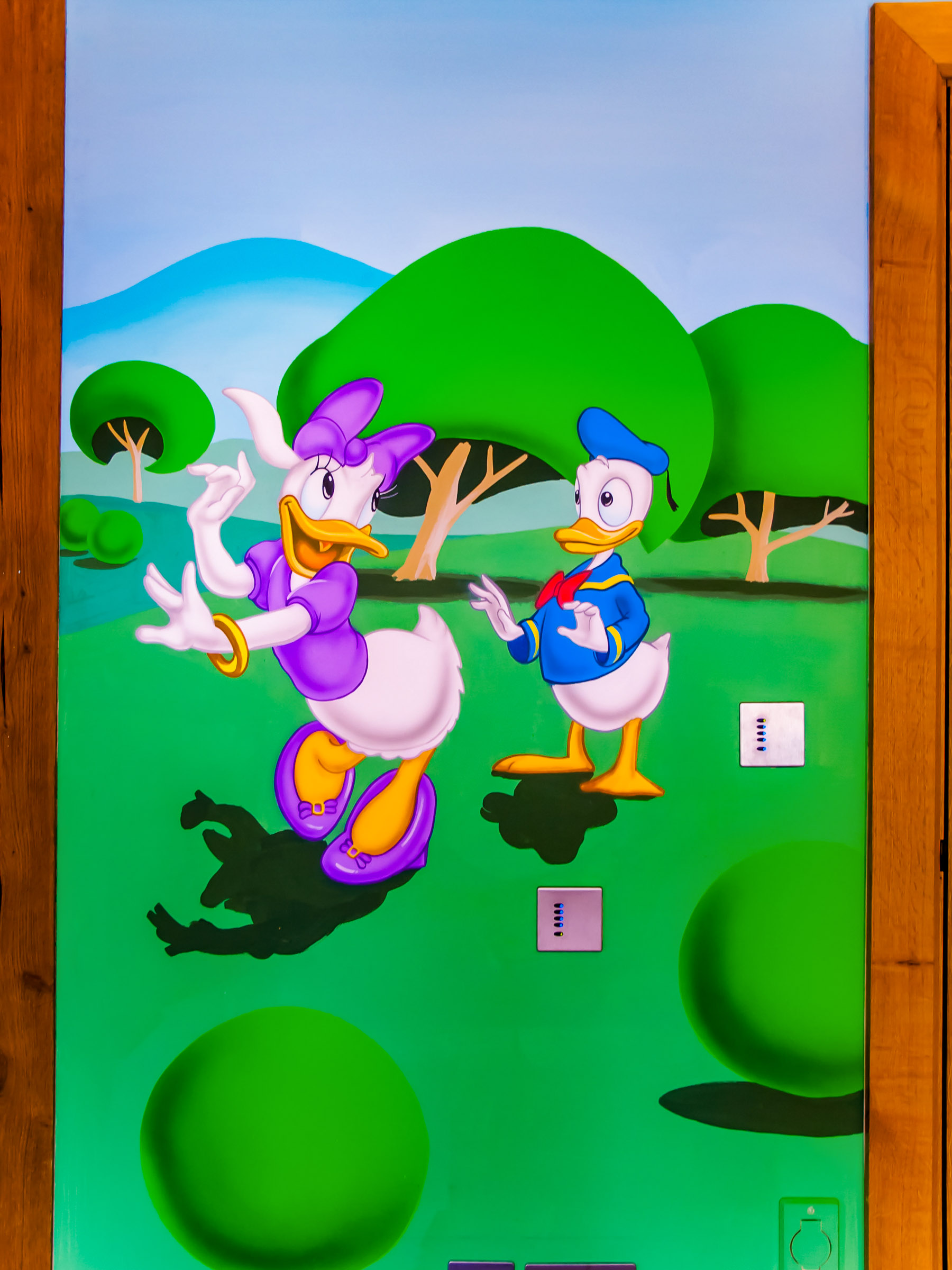 Donald Duck and Daisy Duck detail of the mural, with exposed beams to the sides